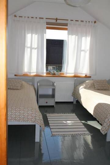 Фото номера Двухместный номер с 2 отдельными кроватями Гостевой дом Guest House Viga г. Павилоста 33